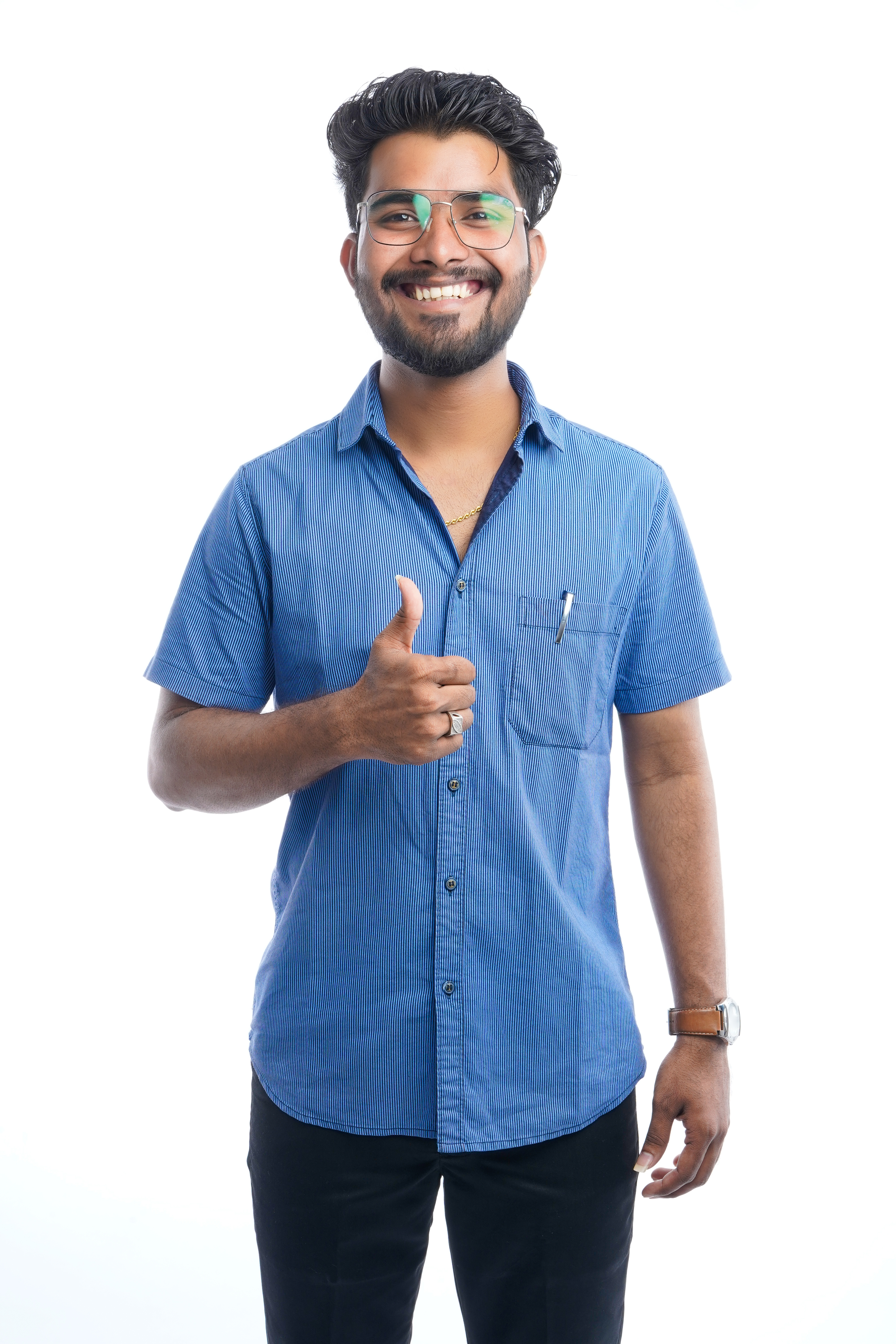 Confident young indian man wearing shirt standing showing thumb against white background, Smiling handsome asian male with positive expression posing.